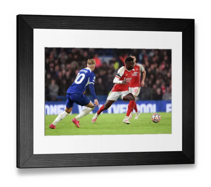Framed Print : Bukayo Saka Charges Forward: Chelsea vs. Arsenal, Premier League 2023-24 Framed Print : Bukayo Saka Charges Forward: Chelsea vs. Arsenal, Premier League 2023-24