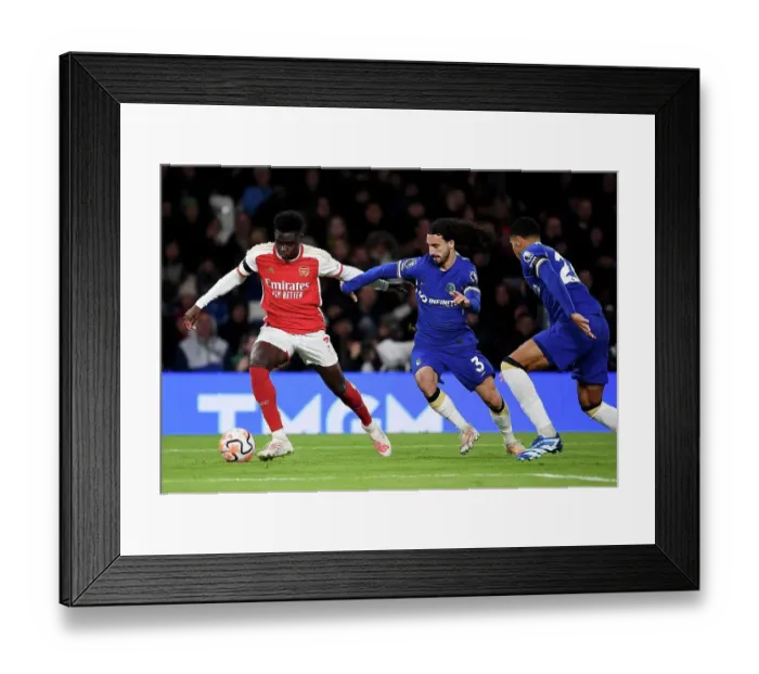 Framed Print : Saka vs. Cucurella: A Premier League Battle at Stamford Bridge (2023-24)