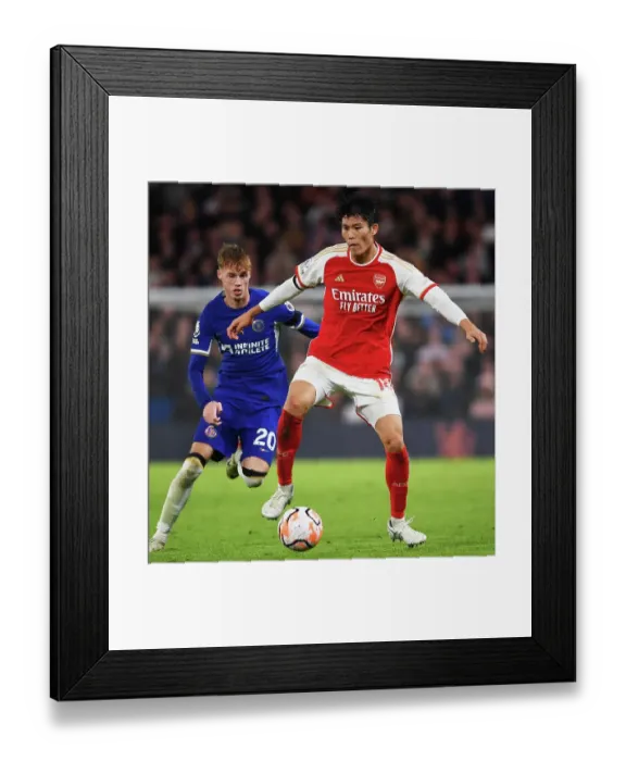 Framed Print : Clash at Stamford Bridge: Arsenal's Tomiyasu Fends Off Chelsea's Palmer (2023-24) Framed Print : Clash at Stamford Bridge: Arsenal's Tomiyasu Fends Off Chelsea's Palmer (2023-24)