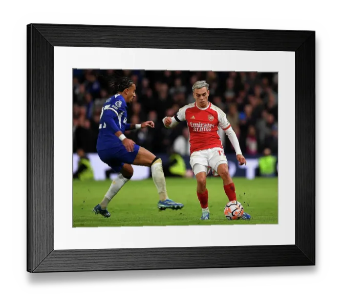 Framed Print : Clash of the Titans: Chelsea vs. Arsenal - Trossard Under Pressure in the 2023-24 Premier League