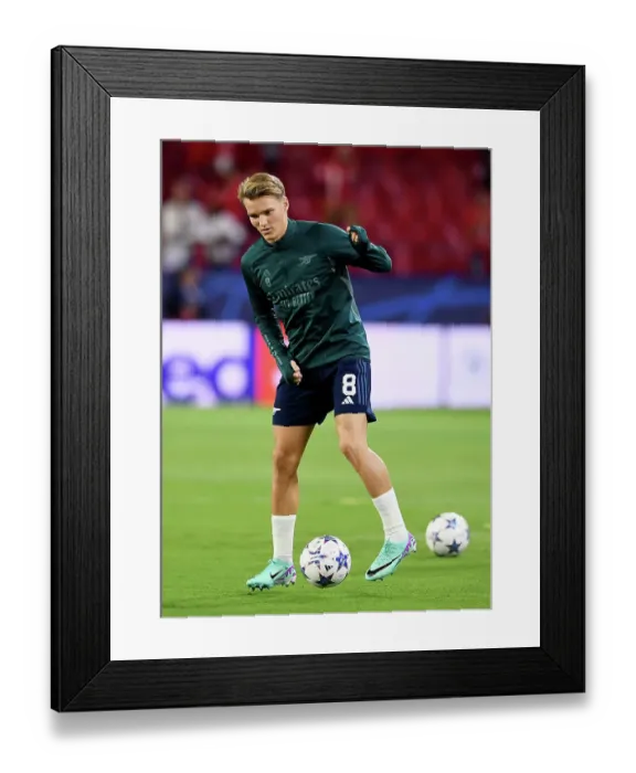 Framed Print : Champions League Showdown: Odegaard's Warm-Up - Sevilla vs. Arsenal (2023-24)