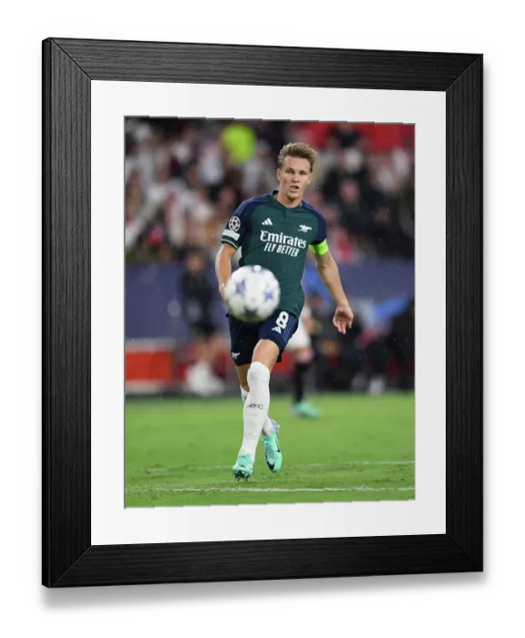 Framed Print : Champions League Showdown: Odegaard Shines as Arsenal Takes on Sevilla Framed Print : Champions League Showdown: Odegaard Shines as Arsenal Takes on Sevilla