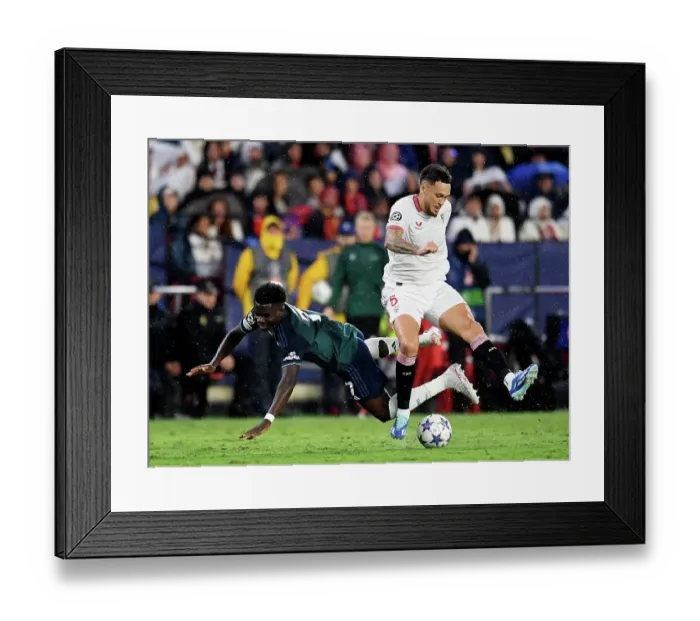 Framed Print : Battling for Possession: Sevilla vs. Arsenal - UEFA Champions League 2023 / 24