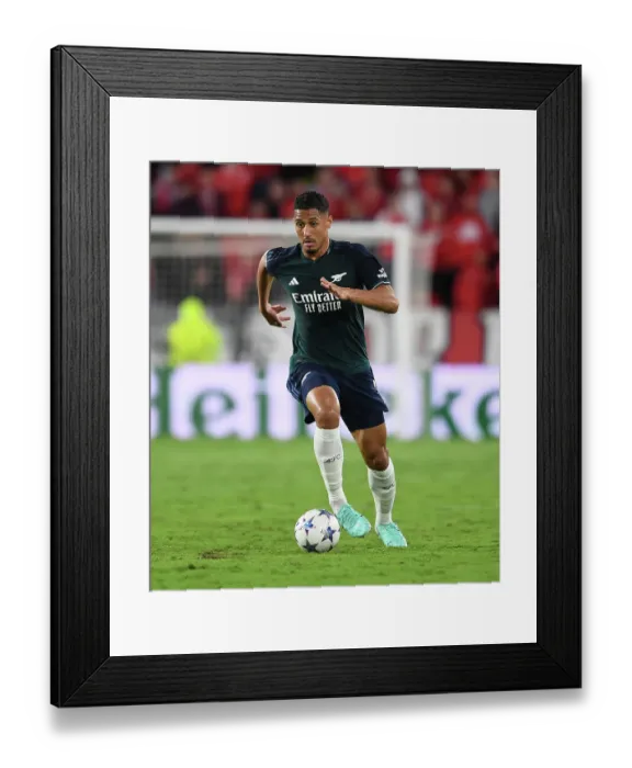 Framed Print : William Saliba's Determined Performance: Arsenal Holds Strong Against Sevilla in Champions League Group B Framed Print : William Saliba's Determined Performance: Arsenal Holds Strong Against Sevilla in Champions League Group B