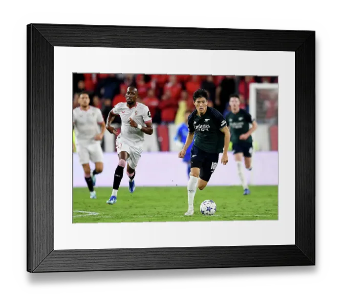 Framed Print : Tomiyasu's Thrilling Display: Arsenal's Win Against Sevilla in the 2023-24 Champions League (Group B)