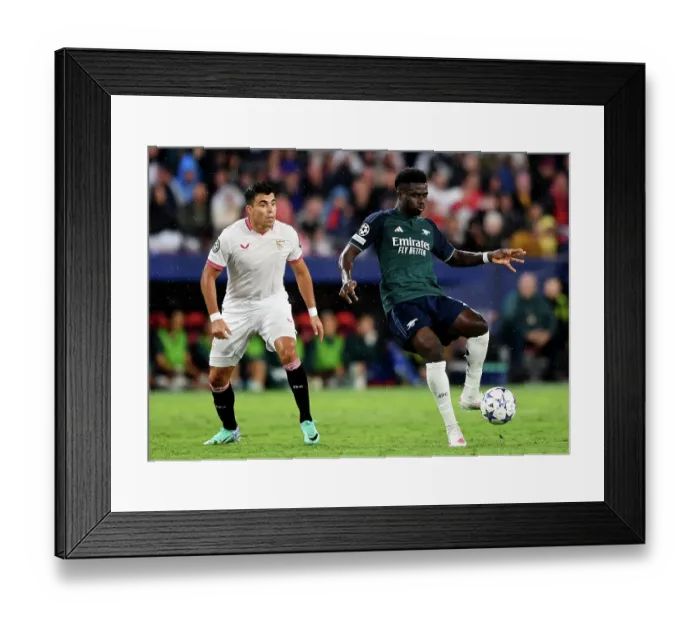 Framed Print : Champions League Battle: Bukayo Saka vs. Marcos Acuna - Wings Collide in Sevilla vs. Arsenal (2023-24)