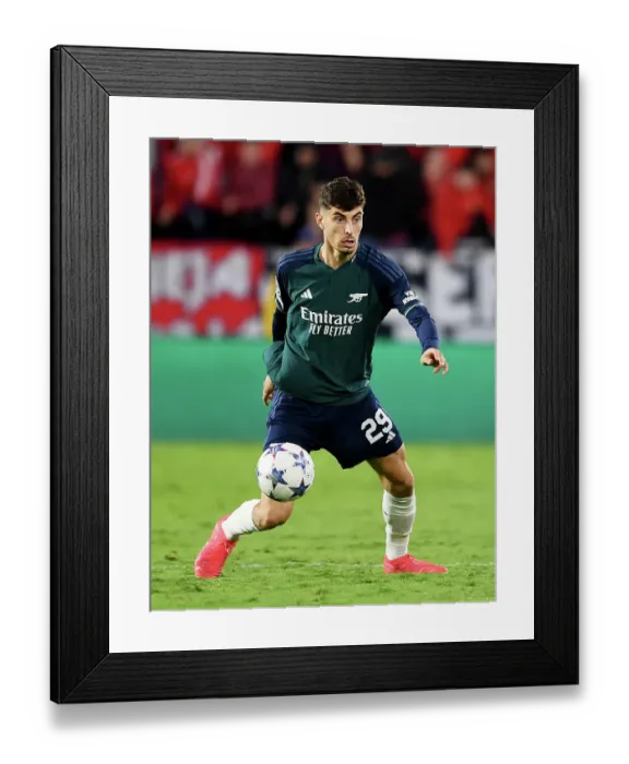 Framed Print : Intense Focus: Kai Havertz's Unwavering Gaze at Sevilla's Estadio Ramon Sanchez Pizjuan during Arsenal's 2023-24 Champions League Clash