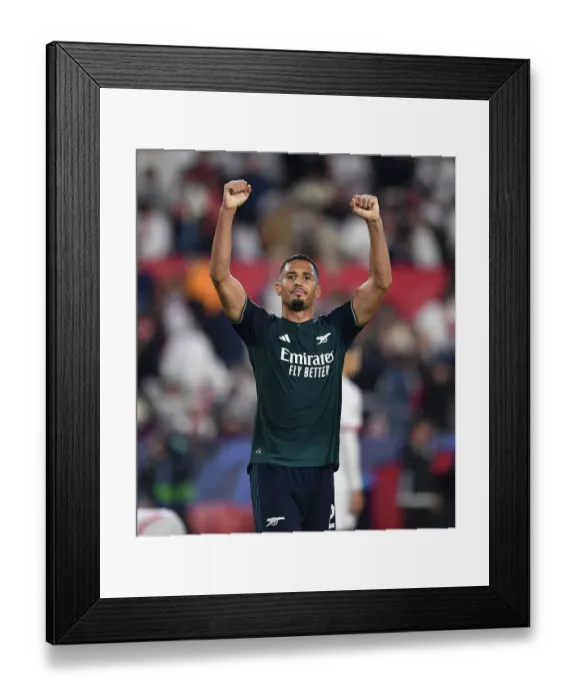 Framed Print : Saliba's Triumph: Arsenal's Champions League Victory at Sevilla