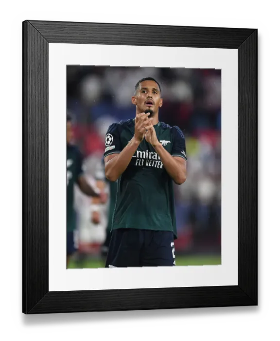 Framed Print : William Saliba's Champion's League Return: Triumphant Salute at Sevilla vs. Arsenal (2023-24) Framed Print : William Saliba's Champion's League Return: Triumphant Salute at Sevilla vs. Arsenal (2023-24)