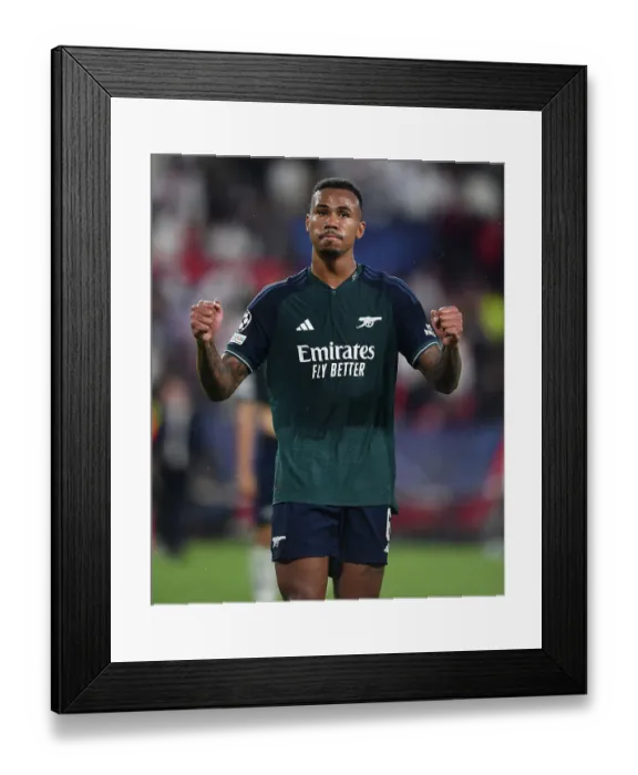 Framed Print : Gabriel Magalhaes Triumph: Arsenal's Champions League Victory over Sevilla