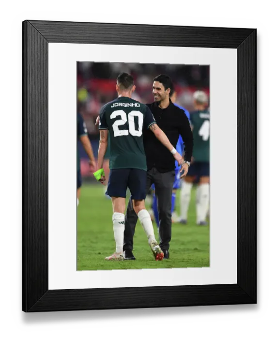 Framed Print : Arsenal's Champions League Triumph: Arteta and Jorginho Celebrate in Seville (2023-24)