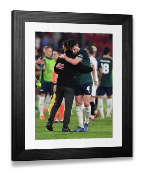 Framed Print : Champions League 2023-24: Mikel Arteta and Declan Rice Embrace Victory After Sevilla vs. Arsenal (Group B)