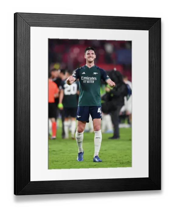 Framed Print : Arsenal Celebrates Champion's League Victory Over Sevilla: Declan Rice Leads the Thrilling Charge