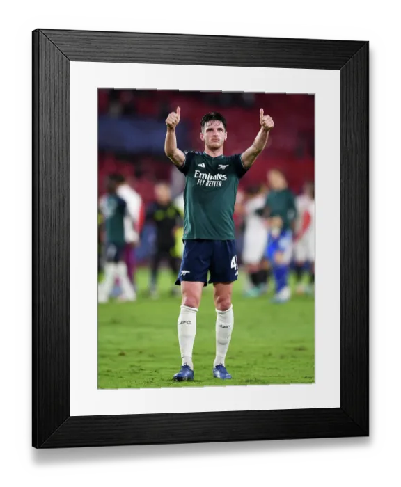 Framed Print : Arsenal Celebrates Victory Over Sevilla in Champions League Group Stage