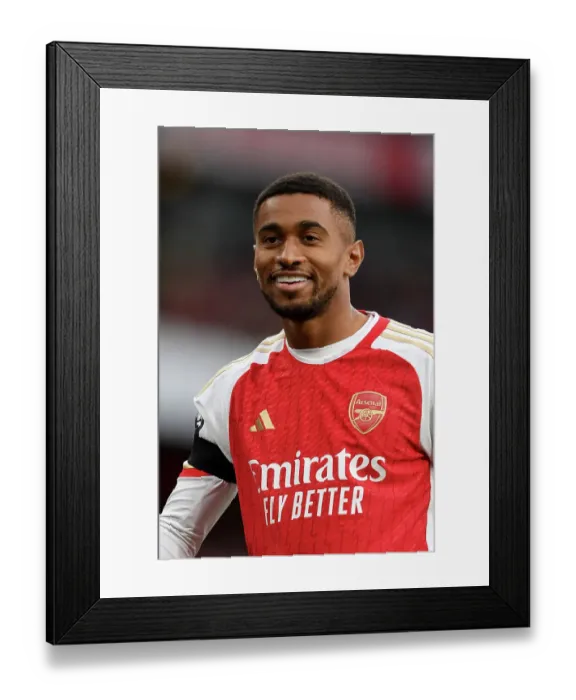 Framed Print : Arsenal vs Sheffield United: Reiss Nelson's Intense Stare at Emirates Stadium (2023-24)