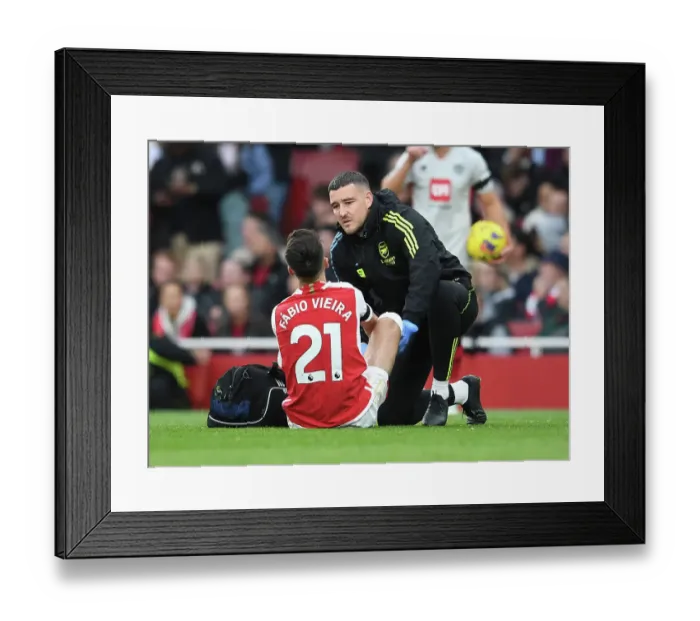 Framed Print : Arsenal's Fabio Vieira Receives Treatment: Arsenal FC vs Sheffield United, 2023-24 Premier League