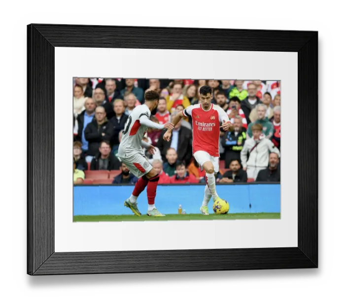 Framed Print : Martinelli vs. Bogle: A Fierce Face-Off in Arsenal's Battle Against Sheffield United