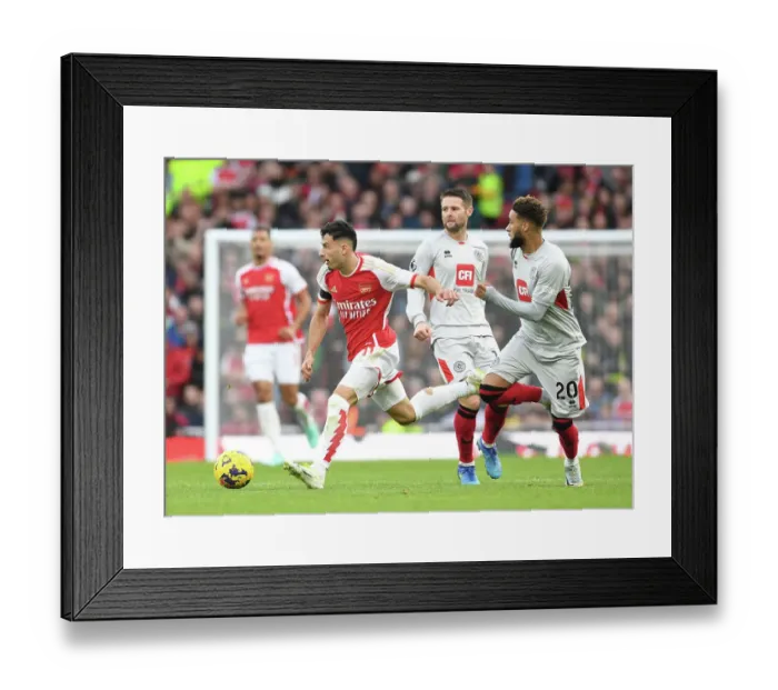Framed Print : Arsenal's Martinelli Outmaneuvers Sheffield United's Bogle in 2023-24 Premier League Clash Framed Print : Arsenal's Martinelli Outmaneuvers Sheffield United's Bogle in 2023-24 Premier League Clash