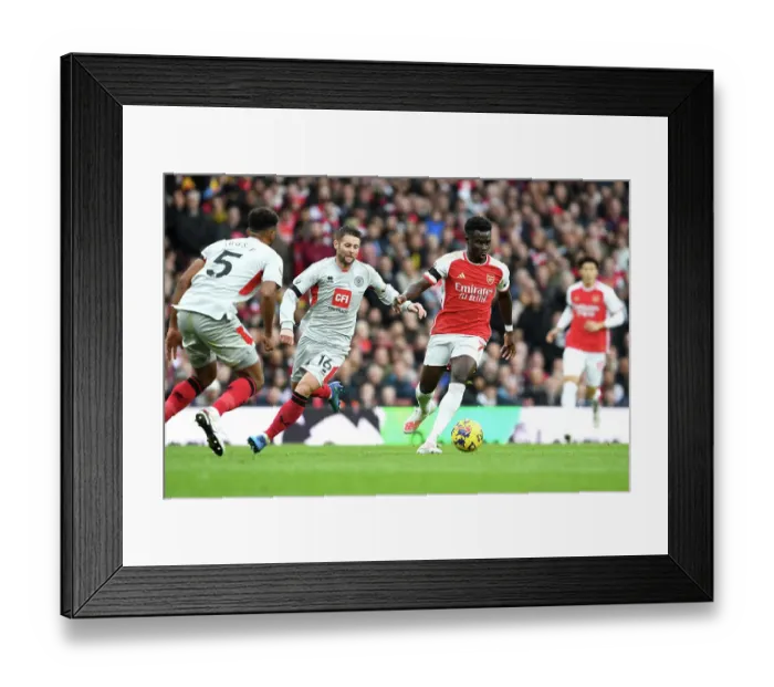 Framed Print : Arsenal's Bukayo Saka Fends Off Sheffield United's Oliver Norwood: Premier League Showdown at Emirates Stadium (2023-24) Framed Print : Arsenal's Bukayo Saka Fends Off Sheffield United's Oliver Norwood: Premier League Showdown at Emirates Stadium (2023-24)