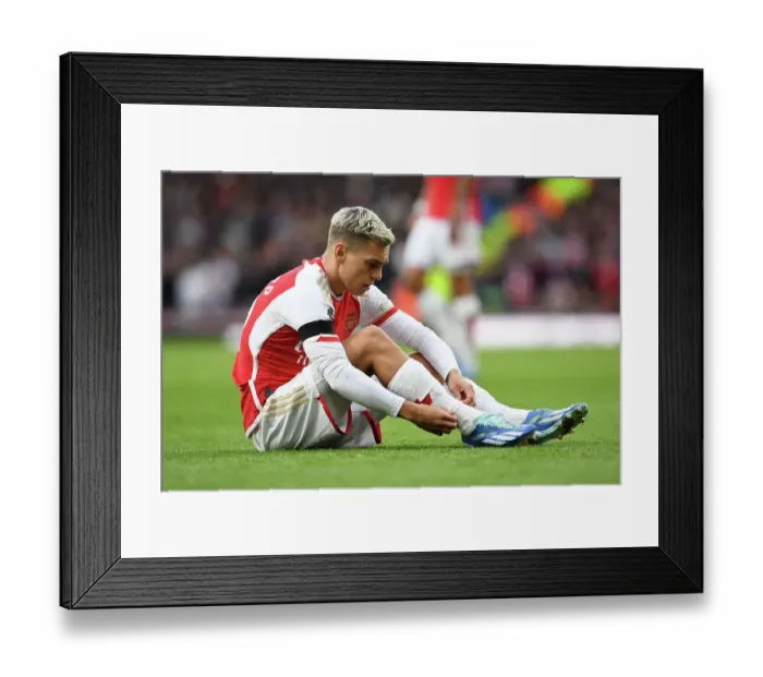 Framed Print : Arsenal's Trossard Adjusts Socks During Arsenal v Sheffield United, Premier League 2023-24 Framed Print : Arsenal's Trossard Adjusts Socks During Arsenal v Sheffield United, Premier League 2023-24