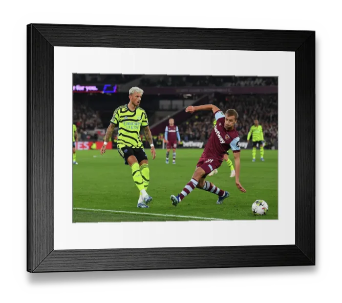 Framed Print : Arsenal's Ben White Faces Pressure from West Ham's Tomas Soucek in Carabao Cup Clash Framed Print : Arsenal's Ben White Faces Pressure from West Ham's Tomas Soucek in Carabao Cup Clash
