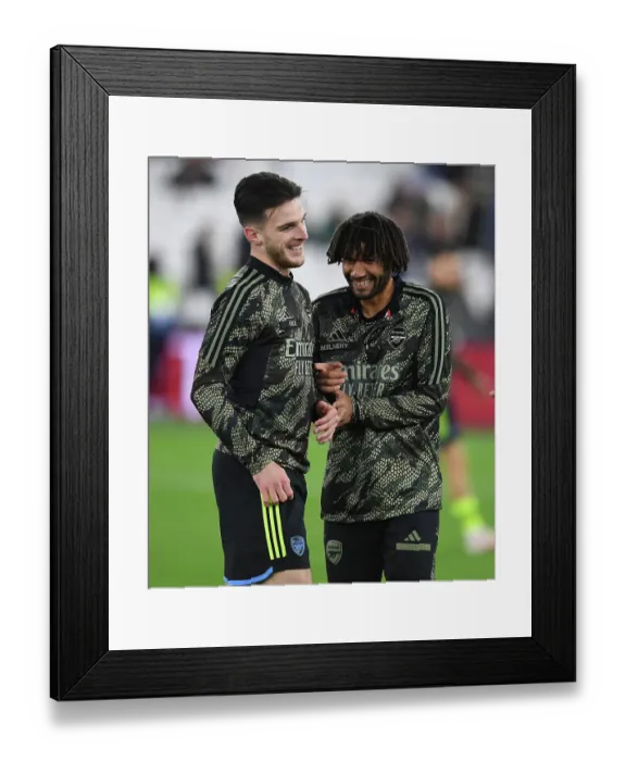Framed Print : Arsenal and West Ham United - Carabao Cup Showdown: Players Warm Up Ahead of Clash