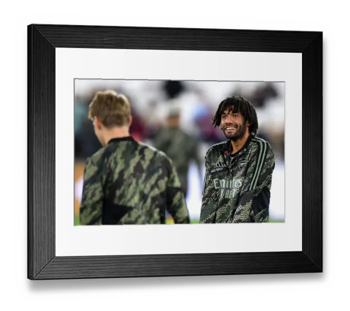 Framed Print : Arsenal's Mohamed Elneny Warming Up Ahead of West Ham Showdown - Carabao Cup 2023-24