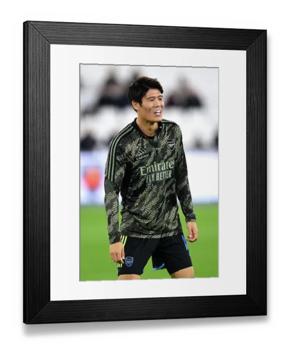 Framed Print : Arsenal's Tomiyasu Warming Up Ahead of West Ham Cup Clash Framed Print : Arsenal's Tomiyasu Warming Up Ahead of West Ham Cup Clash