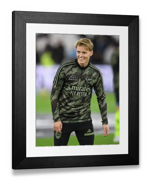 Framed Print : Martin Odegaard's Pre-Match Routine: Arsenal Star Readies for Carabao Cup Battle against West Ham United Framed Print : Martin Odegaard's Pre-Match Routine: Arsenal Star Readies for Carabao Cup Battle against West Ham United