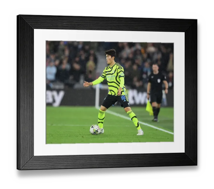 Framed Print : Arsenal's Tomiyasu in Action against West Ham in Carabao Cup Clash Framed Print : Arsenal's Tomiyasu in Action against West Ham in Carabao Cup Clash