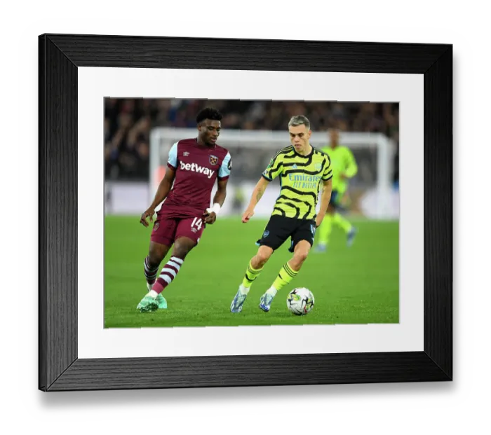 Framed Print : Trossard Under Pressure: West Ham vs. Arsenal in Carabao Cup Clash