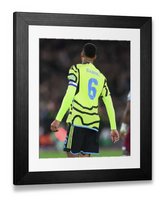 Framed Print : Gabriel Magalhaes Unwavering Concentration: Arsenal's Defender in Carabao Cup Battle against West Ham United (2023-24)