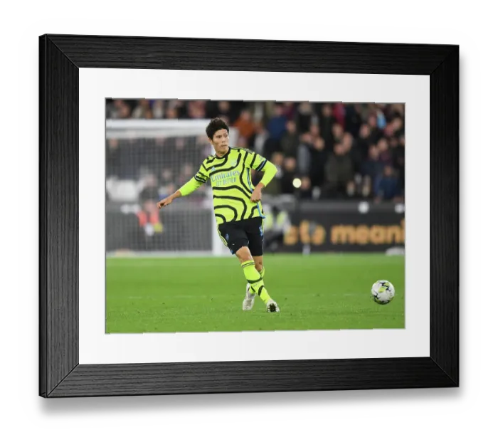 Framed Print : Tomiyasu in Action: Arsenal's Defender Shines in Carabao Cup Clash against West Ham, 2023-24
