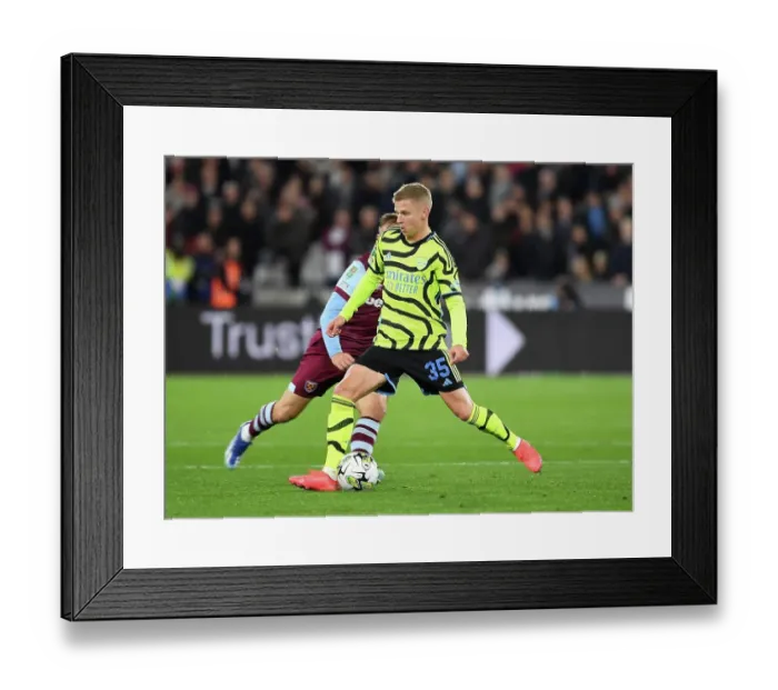 Framed Print : Arsenal's Zinchenko Takes Charge: Carabao Cup Battle at London Stadium