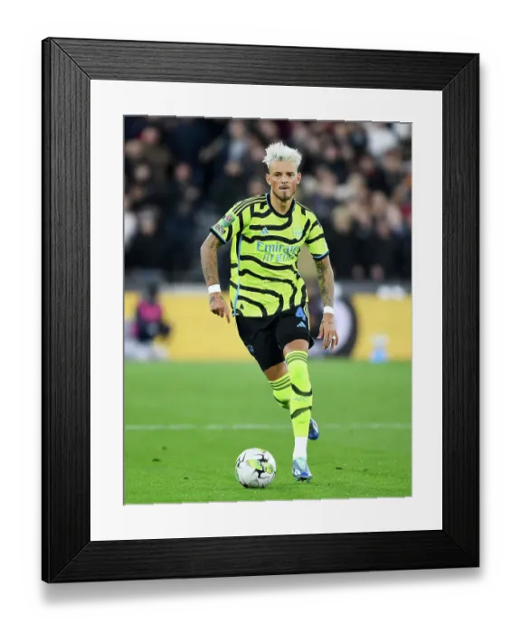 Framed Print : Arsenal's Ben White Sprints Past West Ham in Carabao Cup Clash Framed Print : Arsenal's Ben White Sprints Past West Ham in Carabao Cup Clash