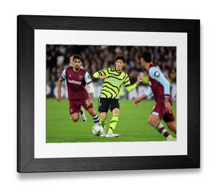 Framed Print : Arsenal's Tomiyasu in Control: West Ham vs Arsenal, Carabao Cup 2023-24
