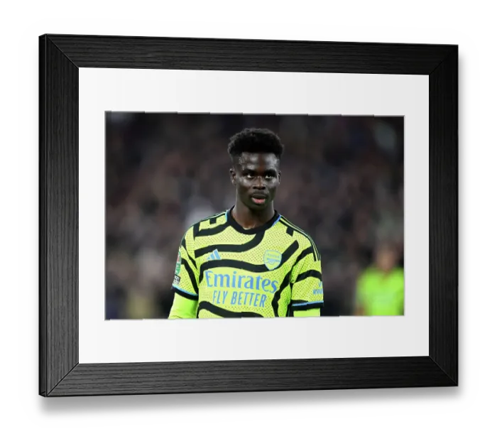 Framed Print : Arsenal's Bukayo Saka Focuses at London Stadium during Carabao Cup Clash vs West Ham United (2023-24)
