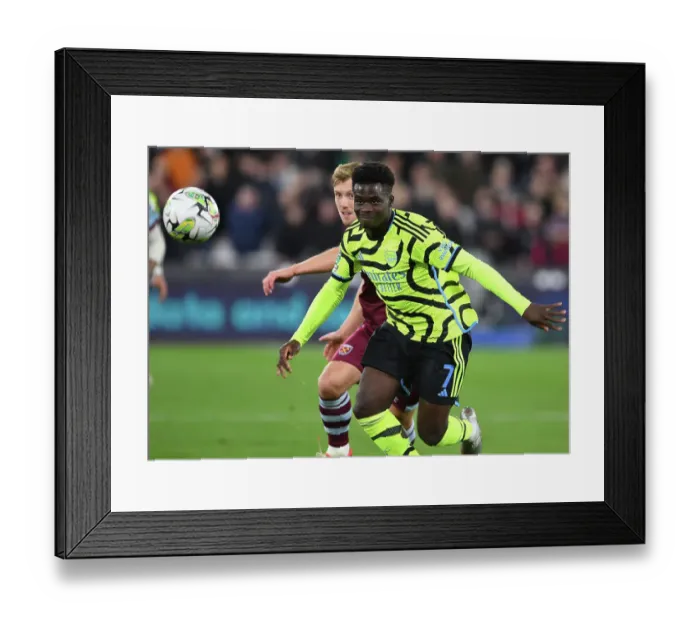 Framed Print : Bukayo Saka Shines: Arsenal's Unstoppable Performance Against West Ham United in Carabao Cup 2023-24