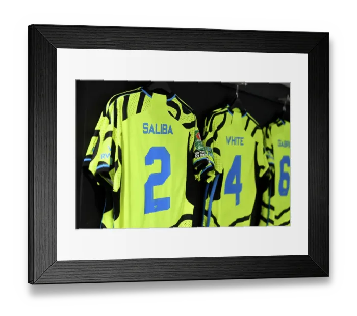Framed Print : Arsenal's Pre-Match Preparation: William Saliba's Jersey in Arsenal Dressing Room (West Ham United vs Arsenal, Carabao Cup 2023-24)