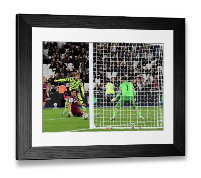 Framed Print : Martin Odegaard Scores First Goal: Arsenal Triumphs over West Ham United in Carabao Cup Framed Print : Martin Odegaard Scores First Goal: Arsenal Triumphs over West Ham United in Carabao Cup