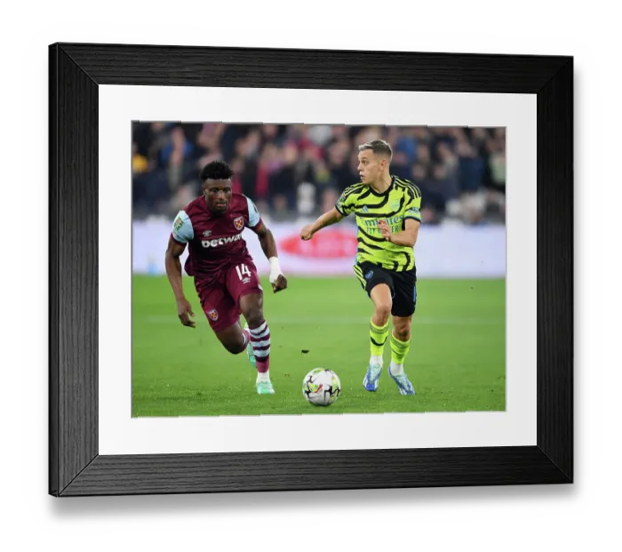 Framed Print : Arsenal's Trossard Battles Past West Ham's Kudus in Carabao Cup Clash