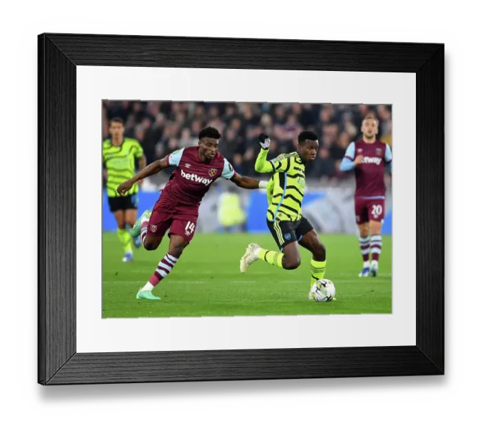 Framed Print : Arsenal's Eddie Nketiah Faces Off Against West Ham's Mohammed Kudus in Carabao Cup Clash