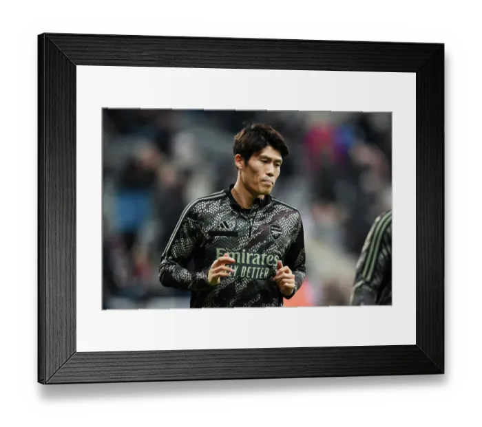 Framed Print : Arsenal's Tomiyasu Readies for Battle: Newcastle United vs Arsenal, Premier League 2023-24