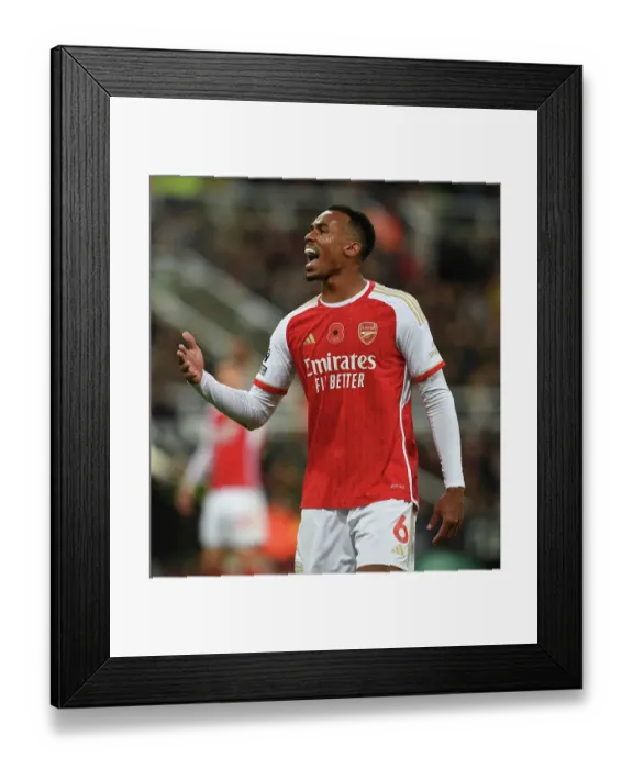Framed Print : Magalhaes in Action: Arsenal vs. Newcastle United - Thrilling St. James Park Showdown, Premier League 2023-24