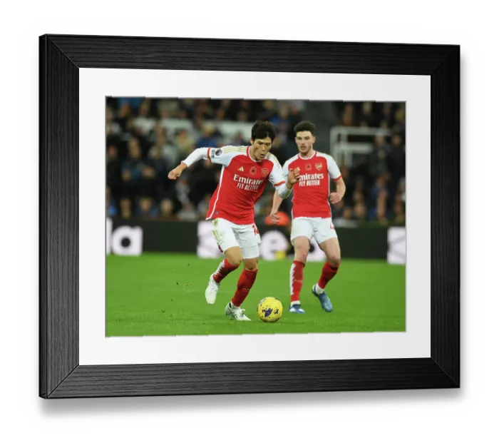 Framed Print : Arsenal's Tomiyasu Faces Newcastle Challenge in Premier League Clash (2023-24)