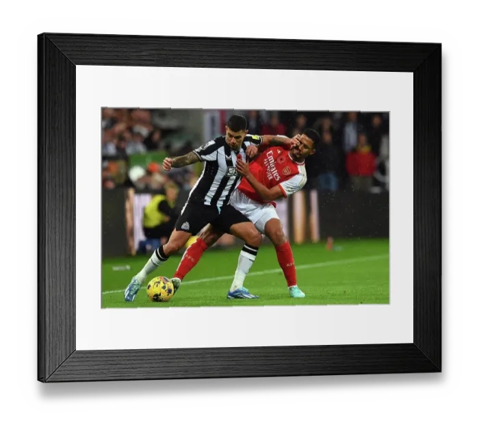 Framed Print : Clash of Titans: Bruno Guimaraes vs. William Saliba - Newcastle United vs. Arsenal FC, Premier League 2023-24