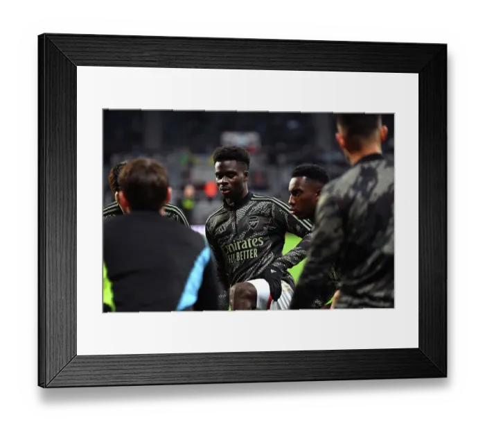 Framed Print : Arsenal's Bukayo Saka Warming Up Ahead of Newcastle United Clash (2023-24) Framed Print : Arsenal's Bukayo Saka Warming Up Ahead of Newcastle United Clash (2023-24)