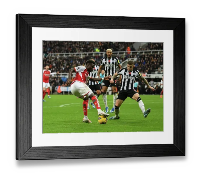 Framed Print : Bukayo Saka Takes on Kieran Trippier: Intense Battle at St. James Park - Arsenal vs Newcastle United (2023-24) Framed Print : Bukayo Saka Takes on Kieran Trippier: Intense Battle at St. James Park - Arsenal vs Newcastle United (2023-24)