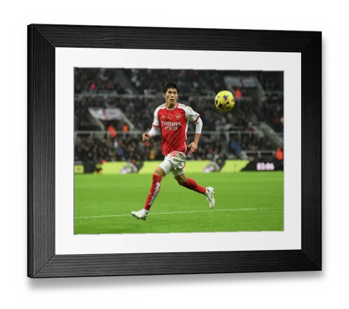 Framed Print : Arsenal's Tomiyasu Shines: Newcastle United vs Arsenal, Premier League 2023-24