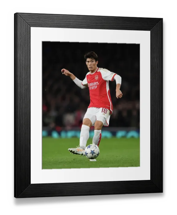 Framed Print : Tomiyasu's Star Performance: Arsenal Triumphs Over Sevilla in Champions League (2023-24)